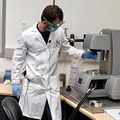 Core technician Charles Bressan demonstrates how to use one of ANTEC's research instruments.